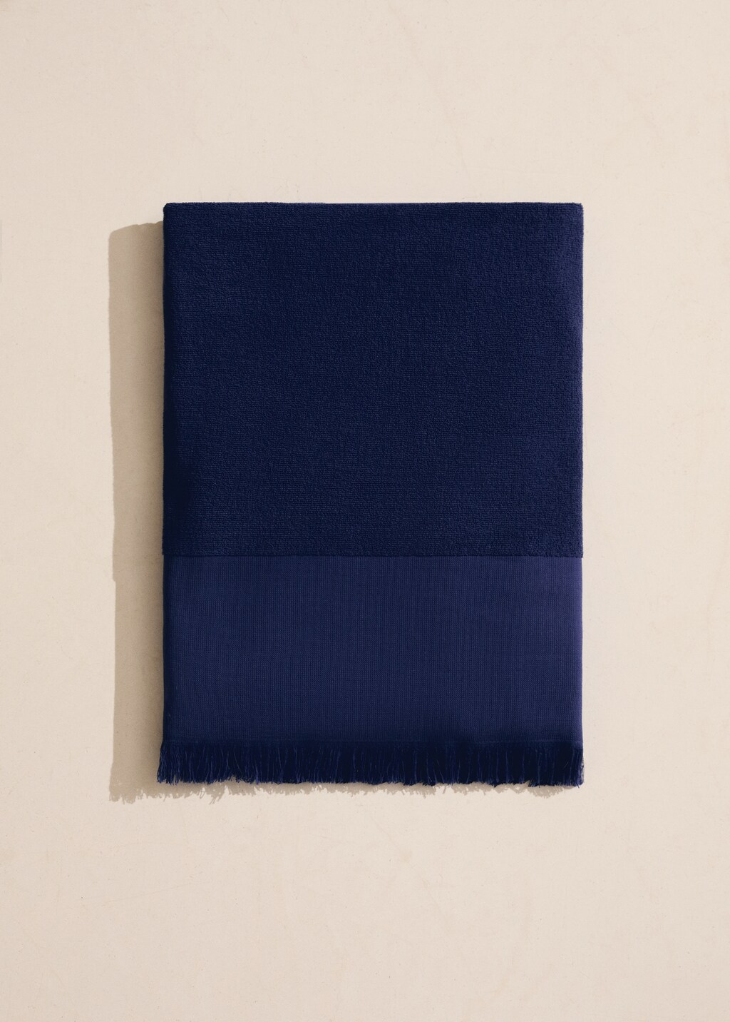 Overdyed terry beach towel with fringes