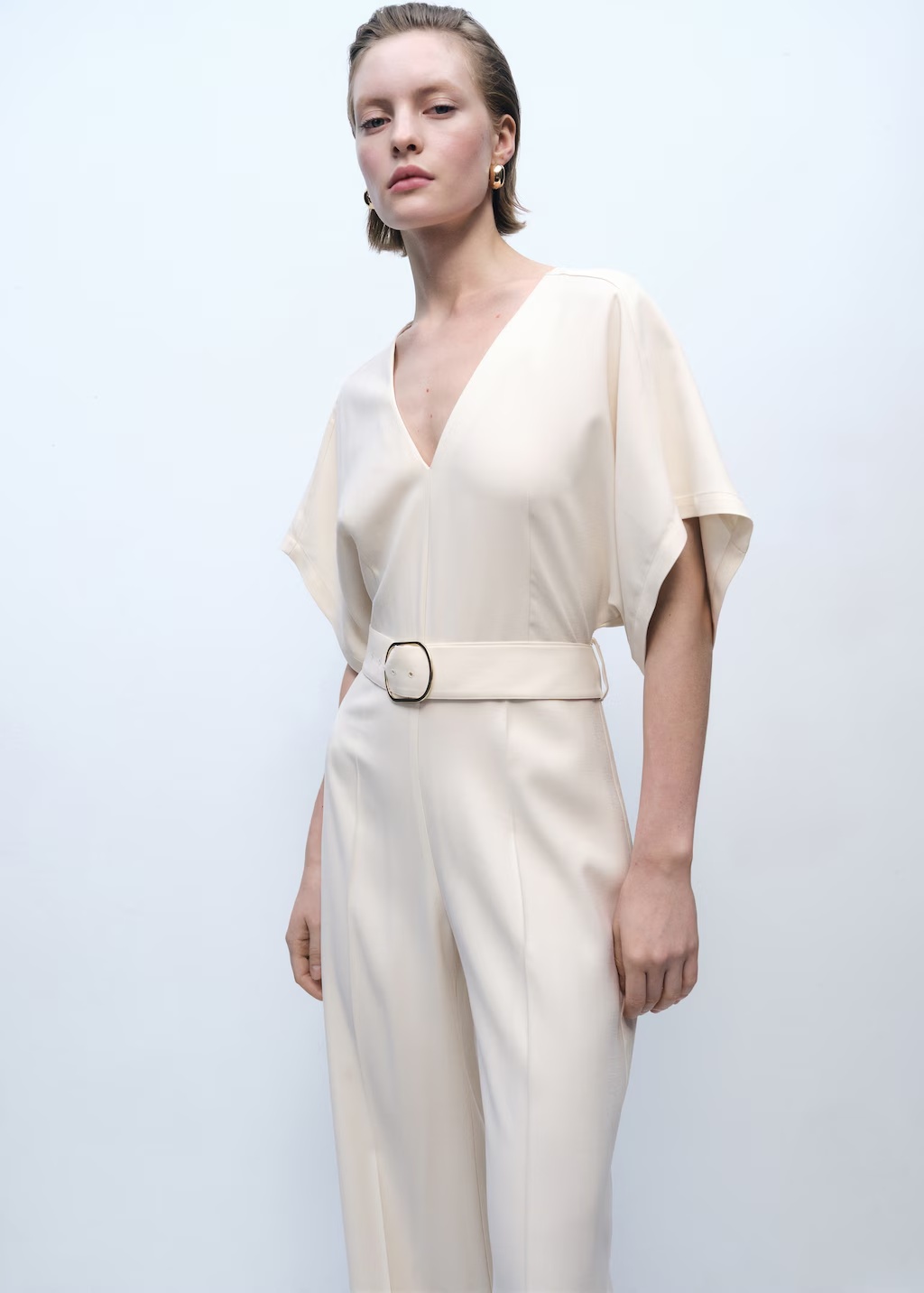 Long jumpsuit with belt and buckle