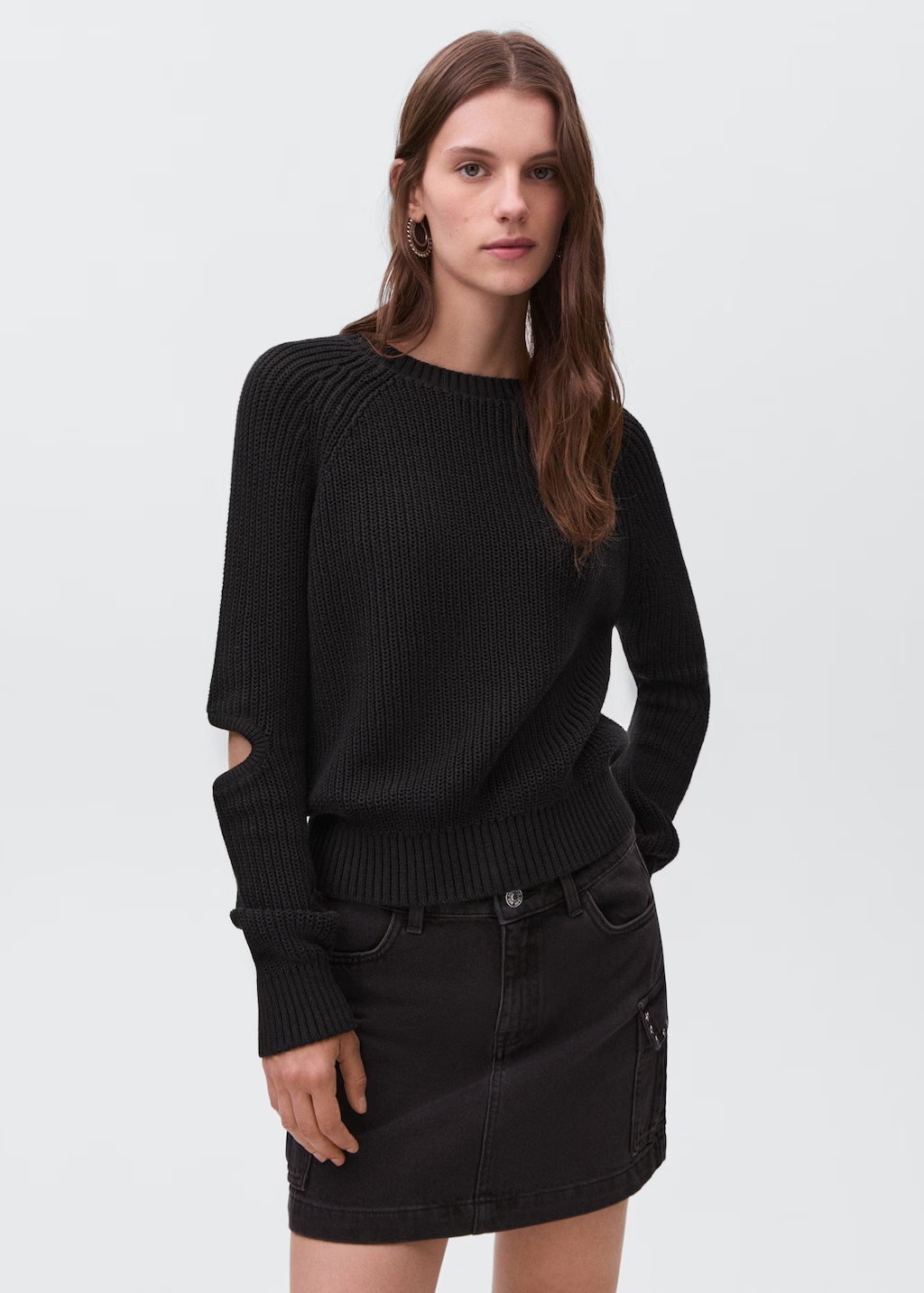 Knitted sweater with openings