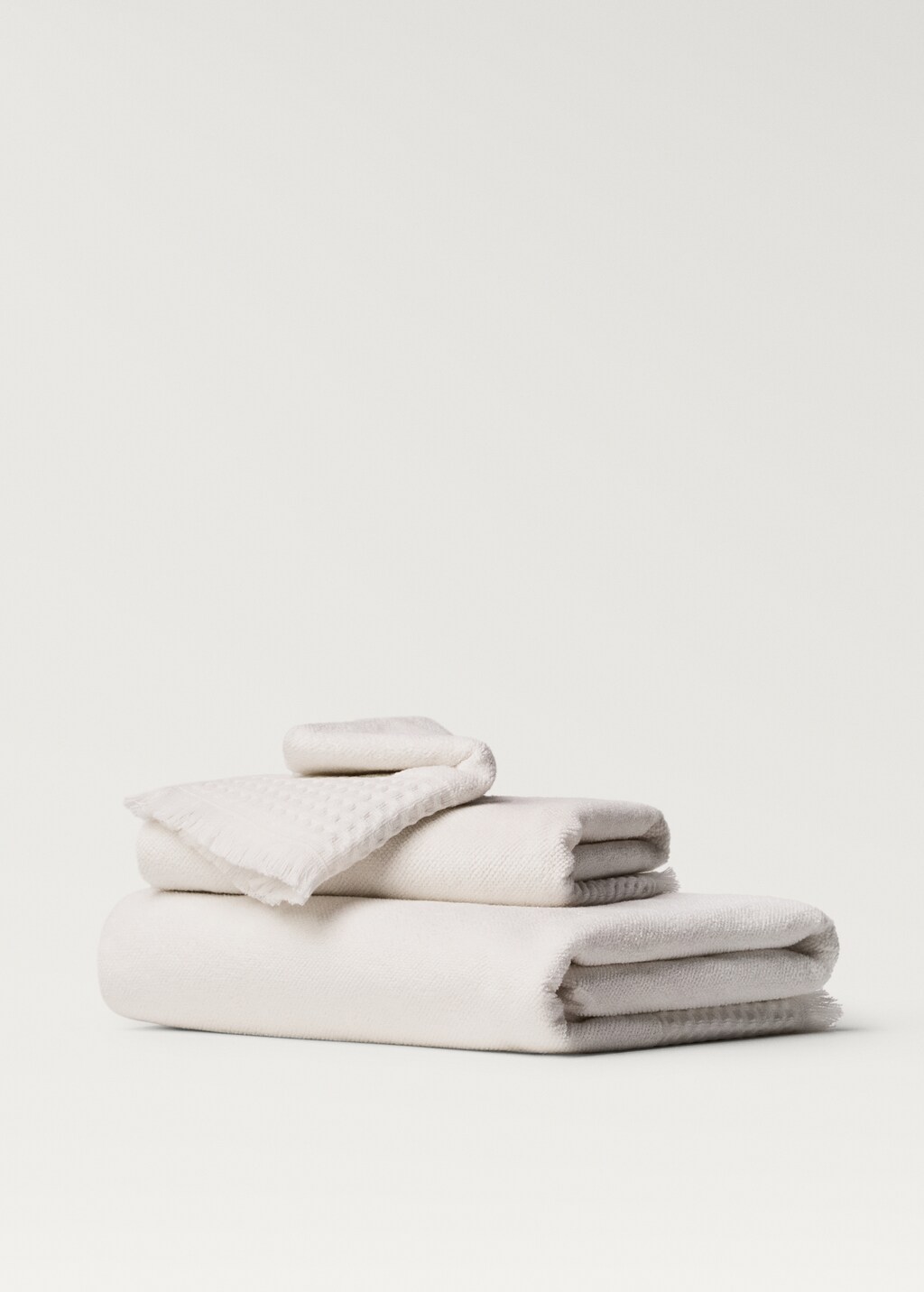 Hand towel with waffle trim and fringe