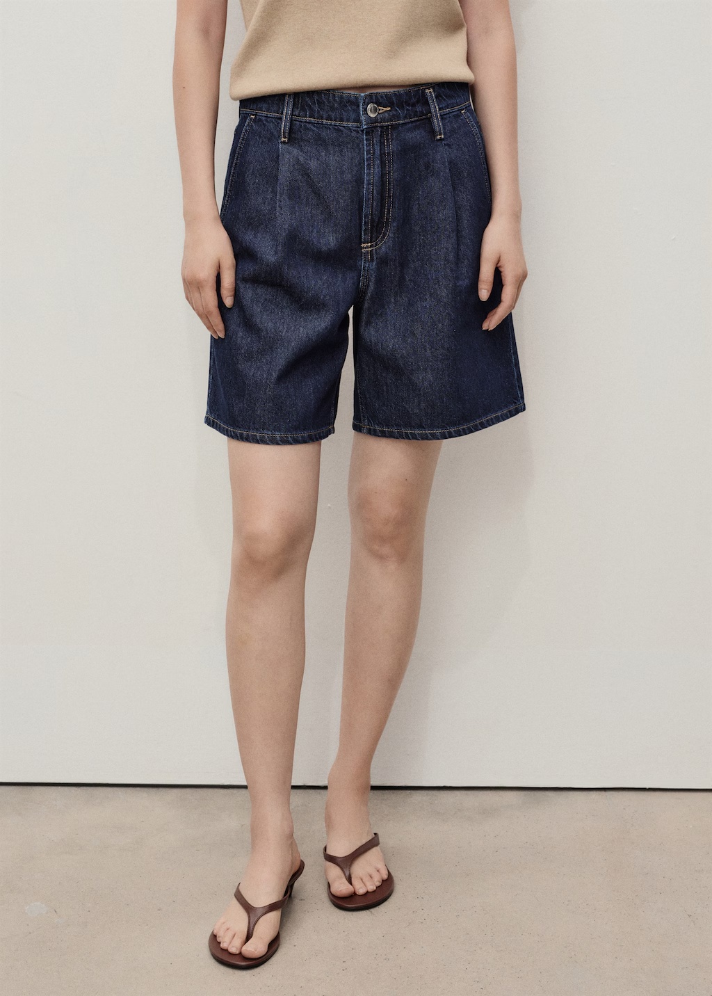 Mid-rise denim bermuda shorts with pleats