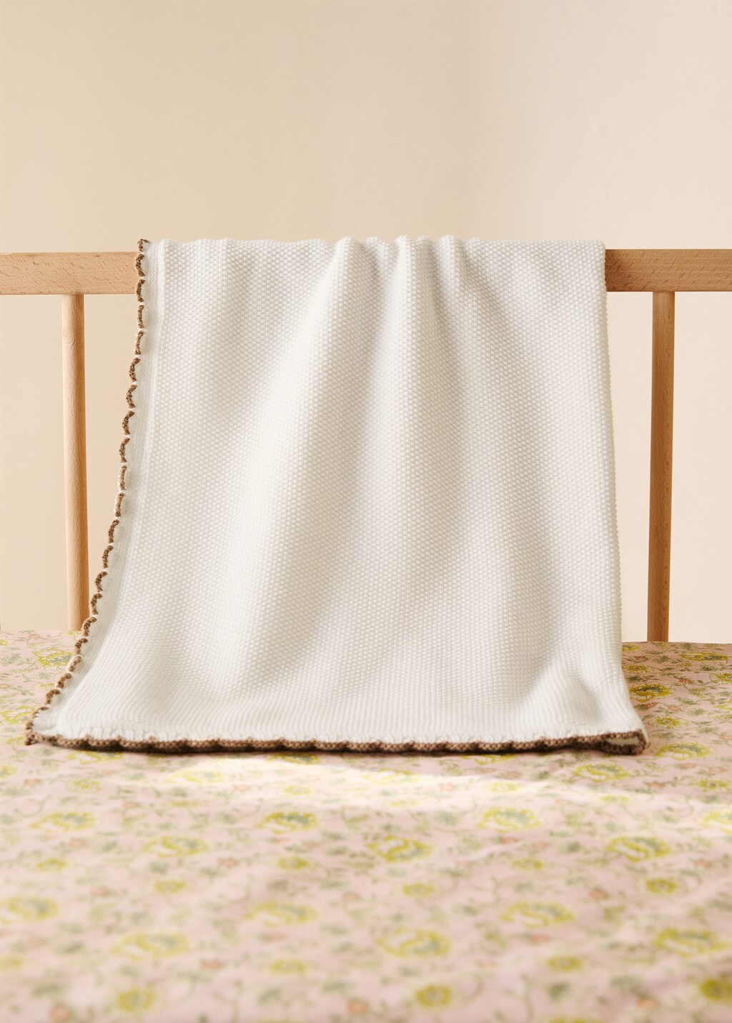 Cotton knitted children's blanket with crochet trim