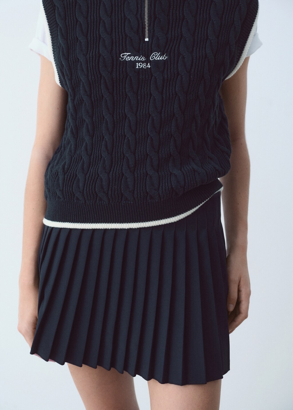 Braided vest with embroidered message