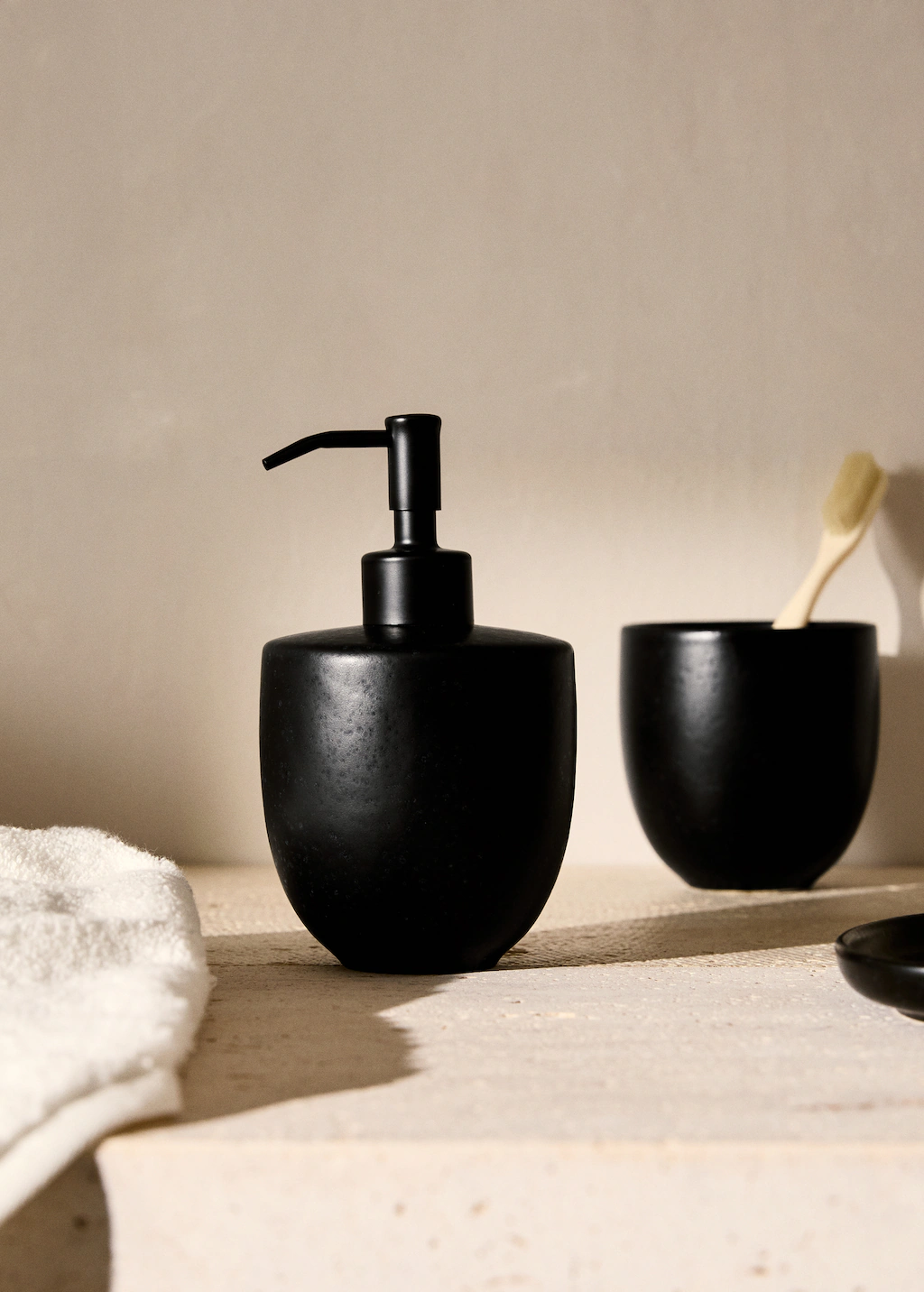 Stoneware soap dispenser with matte finish