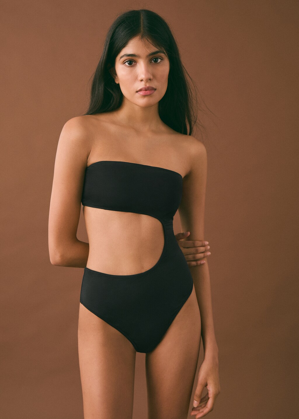 Swimsuit with asymmetrical opening