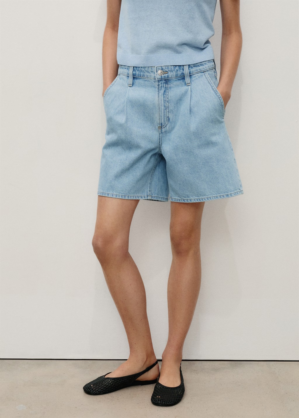 Mid-rise denim bermuda shorts with pleats