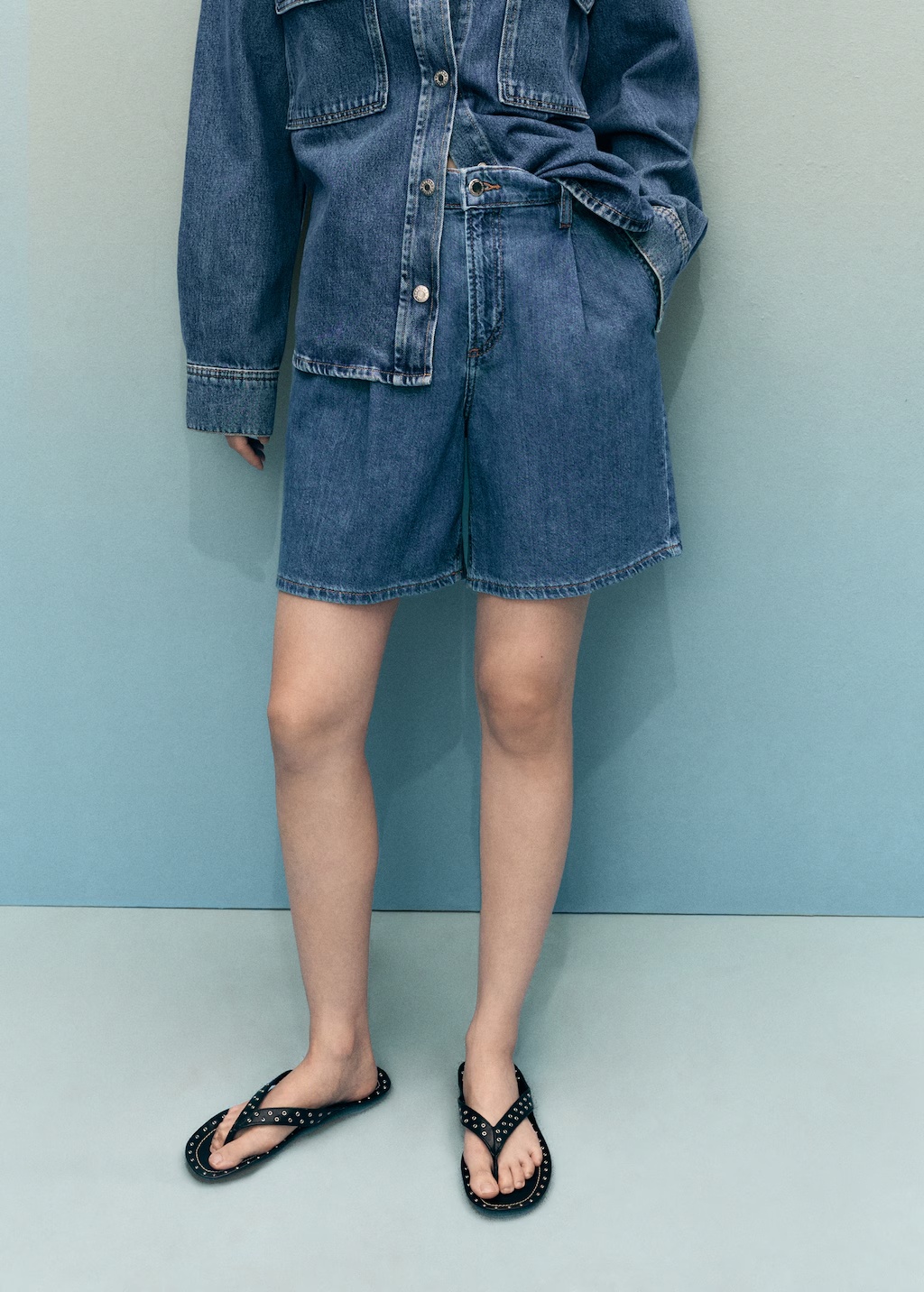 Mid-rise denim bermuda shorts with pleats