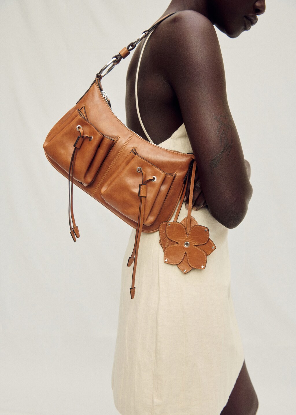 Leather shoulder bag with gathered pockets